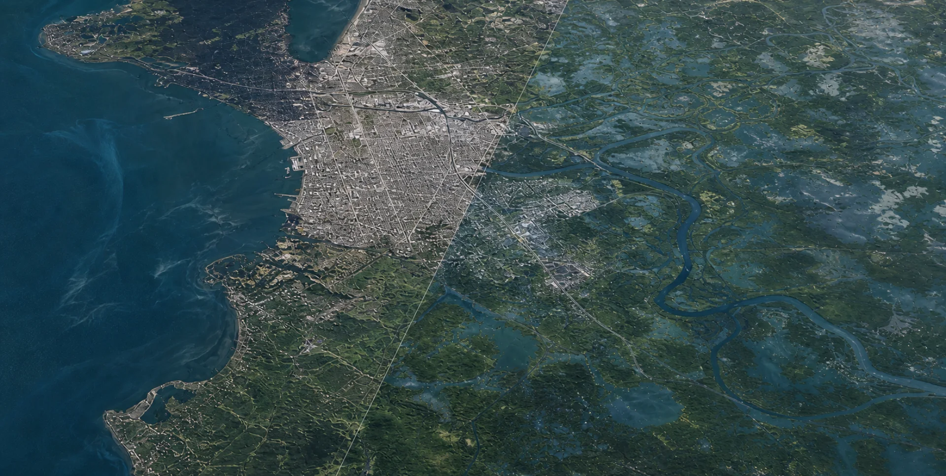 Top-down geospatial view of a coastal city and wetlands